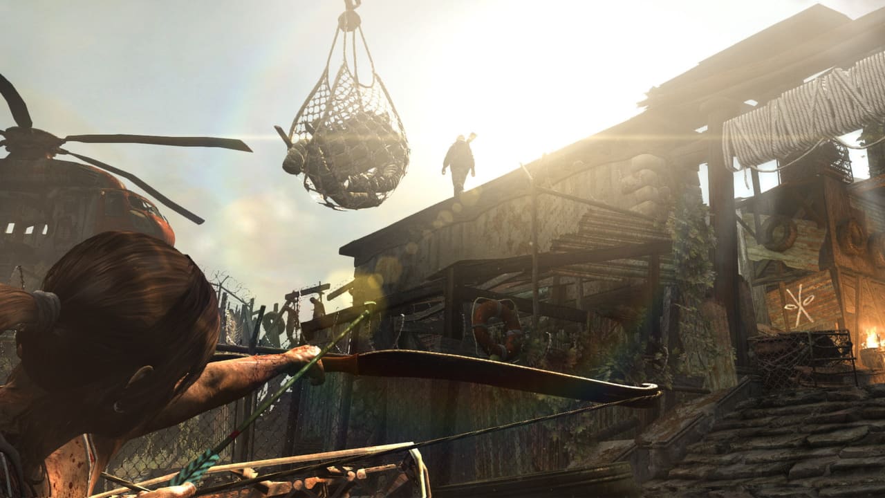 Tomb Raider — zip-line traversal through burning village